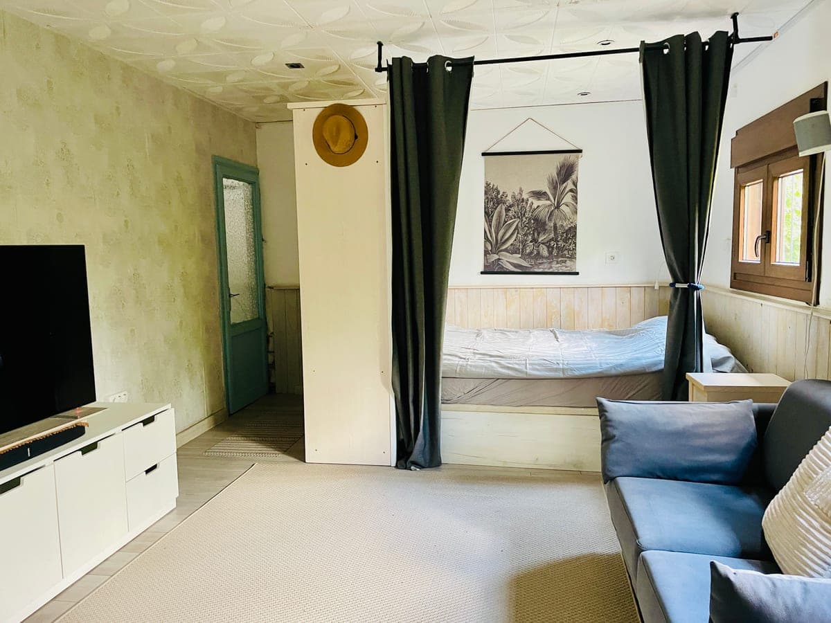 The main house bedroom, with its curtained alcove.