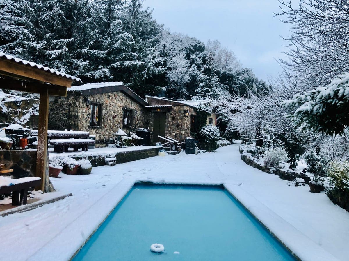 The pool ringed with snow.
